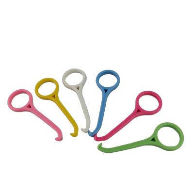 China Dental Orthodontic Invisible Braces Removal Hook ABS Yellow Green White Pink Braces Puller For Sale for sale