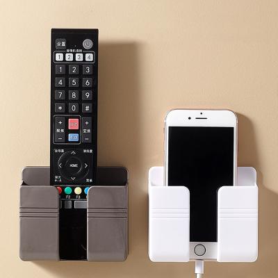 China Modern Bedside Wall Mounted Punch-free Placement Holder Wall Storage Box Mobile Phone Charger Remote Control Storage for sale