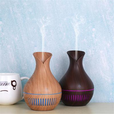 China Car Wooden Grain Mini Aroma Diffuser Flower-Shaped Hollow 130ml USB Portable Air Humidifier with Night Light for sale