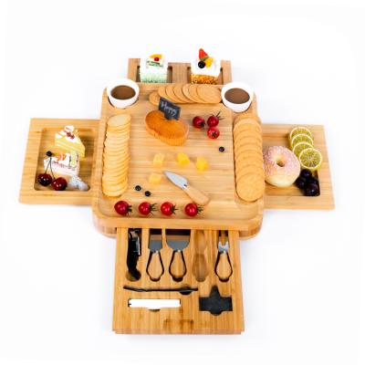 China Stocked Custom Logo Slide-Out 4 Drawers With Stainless Cutlery Square Unique Bamboo Cheese Cutting Board Set for sale