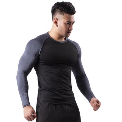 China Anti-Wrinkle Trendy Fashionable Mens Sportswear Long Sleeved Workout Clothes for sale