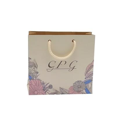 China Recyclable Luxury Ribbon Handle Boutique Shopping Packaging Customized Printed Euro Paper Gift Bags With Logo for sale