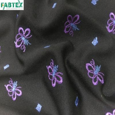 China Comfortable Wicking Butterfly Embroidery 100% Polyester Interlock With Embroidery Design For Garment Shirt #N20729 for sale