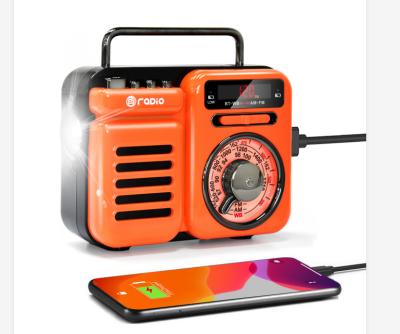 China Retro LED Flashing Light Portable with MP3 Player Speaker Solar Power Bank Crank Time Radio for sale