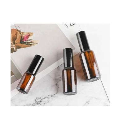 China Custom Round 10ml 30ml 50ml 100ml Personal Care Portable Amber Glass Spray Bottle With Pump Amber Pharmaceutical Spray Glass for sale