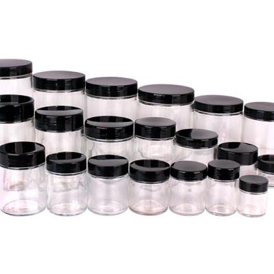 China Multifunctional Food All Size Clear Glass Jar With Black Lids Stored Glass Food Jar Storage Bottle With Metal Lid for sale