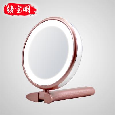 China Round Lighted Pointed Foldable Led Makeup Table Hand Held Cosmetic Girls Daily Mirror for sale