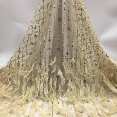 China Z006 fashionable and high quality stone embroidery lace fabric fashionable and high quality noble elegant noble Africa feather hot drilling fabric for sale