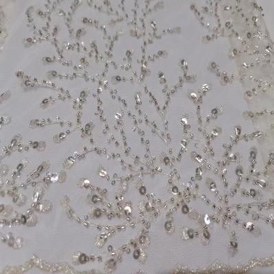 China Viable White Sequined Bridal Mesh Fabric French Tulle Lace Wedding Lace Fabric With Beads for sale