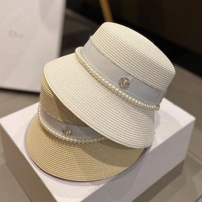 China INS Stylish High Society Woman COMMON Wind Lady Hat Summer Pearl Bucket Hat Rhinestone Shade Straw Hat for sale