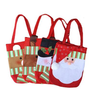 China 2022 New Non-woven Fabric Cartoon Christmas Stationery Tote Bag Santa Gift Bag for sale