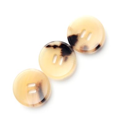 Cina 2 Holes Real Buffalo Horn Women Men Special Widely Used Natural Clothing Dry Cleaning Design Sewing Button in vendita