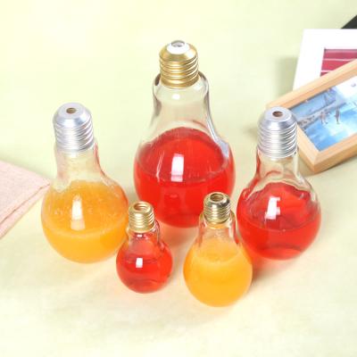 China New Liquaid Bulb Shaped Clear Custom Glass Juice Bottle For Bar for sale