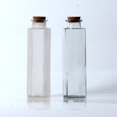 China Beverage Factory Price Good Quality 6 Sides Glass Juice Bottle With Wooden Cork for sale