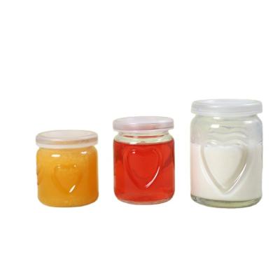 China 2021 Milk Series Empty Glass Pudding Glass Jar With Heart Shape And Plastic Lid for sale