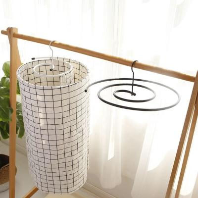 China New Durable Comforter Drying Rack Spiral Shaped Revolving Hanger Quilt Storage Rack Hanger for sale