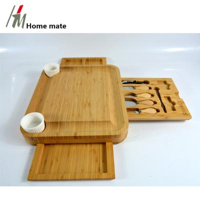 China Sustainable Kitchen Cheese Board And Knife Set Bamboo Dish Cut Board Serving Tray Charcuterie Platter With Slide-out Drawer for sale