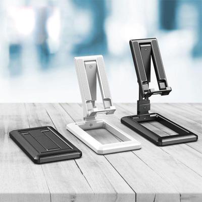 China Newest High Quality Adjustable Lazy Bracket Mobile Phone Accessories Adjustable Dual Folding Aluminum Phone Holder Stand for sale