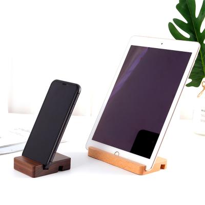 China Compatiable with promotional cell phone holder black walnut beech cell phone gift ipad wood lazy desktop stand cell phone holder for sale