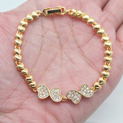 China TRENDY 18K Gold Plated Clear CZ Cubic Zircon Twist Heart Charm Wedding Bracelet Women Jewelry for sale