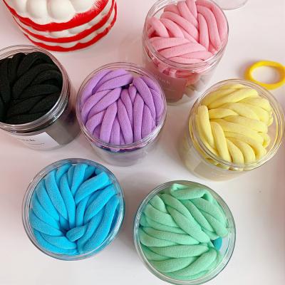 China 50pcs/pack Soft Candy Color Girls Hair Band Women Elastic Stretch Band Seamless Adult High Towel Hair Tie for sale