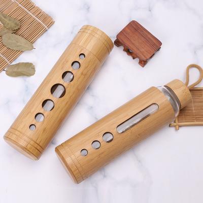 China Sustainable Eco Friendly Water Bottle Drinking Insulated Glass Water Bottle With Bamboo Sleeve And Bamboo Lid for sale