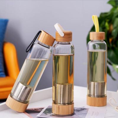 China Sustainable Portable Premium Round Glass Water Bottle 420ml 550ml With Tea Infuser for sale