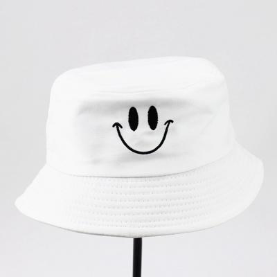 China Luxury UV Protection Smile Embroidery Bucket Hats Tie Dye Cow Colored Bucket Hat With Custom Logo for sale