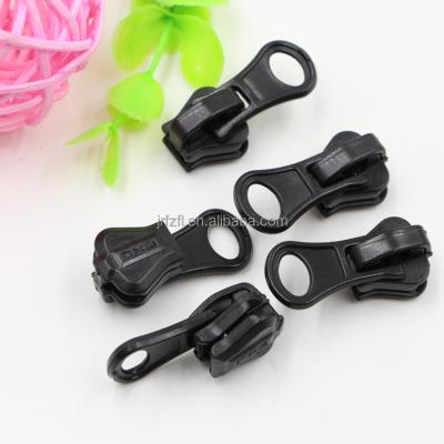 China Black Zipper Sliders Nickel Free Non Locking Zipper Sliders Different Sizes With Long Pullers for sale