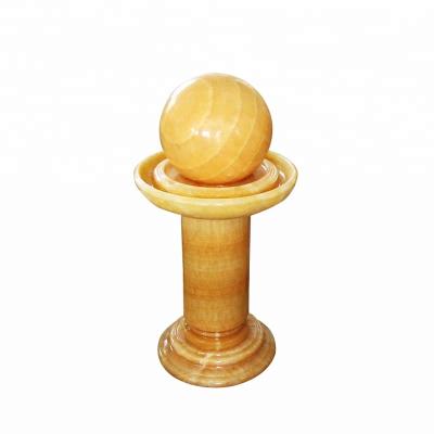 China Low Price Honey Onyx Fountain Ball Stone Garden for sale