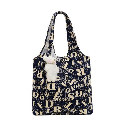 China Portable New Korean version of leisure canvas bag large capacity printed hand carry fashion single shoulder shopping bag for sale