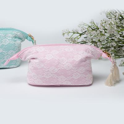 China Lady Clutch Handbag Tassel Zipper Cosmetic Bag Vintage Essential Oil Vintage Lace Bag Portable Essential Bag Storage Bag for sale