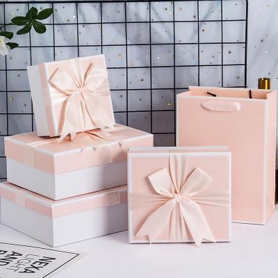 China Recycled materials wholesale birthday box with keepsake pink and blue bag bows packaging empty paper gift box for sale