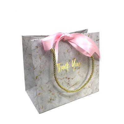 China Recycled Materials Wholesale Custom Logo Custom Gift Bags For Shopping Clothes Gift Shopping Paper Bag for sale