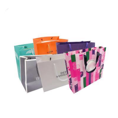 China Recycled Materials Wholesale Custom LOGO Luxury Black Gift Bags Logo Shopping Bags Cardboard Paper Bags for sale