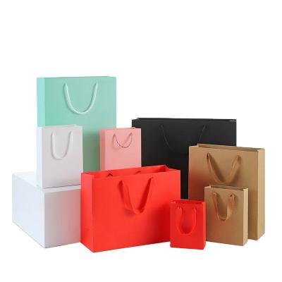 China Custom Small Gift Bag Recycled Materials Logo Luxury Clothes Retail Shopping Paper Bags For Clothing Store Tote Bags for sale