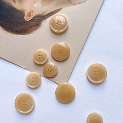 China Dry Cleaning And Water Washing High Quality And Environmentally Friendly Resin Circular Buttons For Customized Four Hole Suit Anorak Buttons for sale