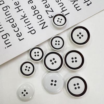 China Custom Eco-Friendly Dry Washable Black And White Matte Costume Buckle With 4 Hole Resin Sewing Buttons for sale