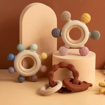 China Newest Toy COMEMOIR Mix Color Beech Wood Soft Non-Toxic Rudder Teething Beads Sensory Toy Silicone And Wooden Baby Teether Ring for sale