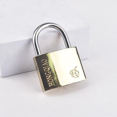 China Durable High Security 32MM Imitation Copper Short Beam Finishing Treatment Iron Titanium Guard Lock For Door for sale