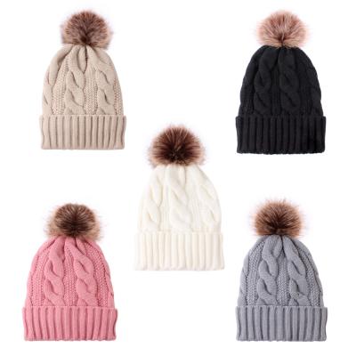 China COMMON Wholesale Customized Knitted Hats Warm Winter Faux Fur Ball Pom Pom Plain Beanie Hat for sale