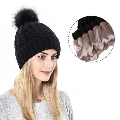 China COMMON high quality custom made winter hats ribbed women knit pom pom satin striped beanie hats for sale