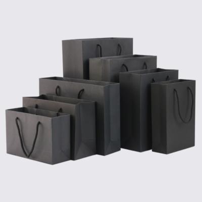 China Wholesale Recyclable Printed Custom Black Kraft Paper Gift Craft Shopping Paper Bags With Handle for sale