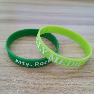 China Debossed logo printed or promotion silicone embossed wristbands for sale