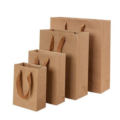 China Recyclable Wholesale Shoes And Clothing Bag Custom Kraft Paper Shopping Bags With Logo for sale