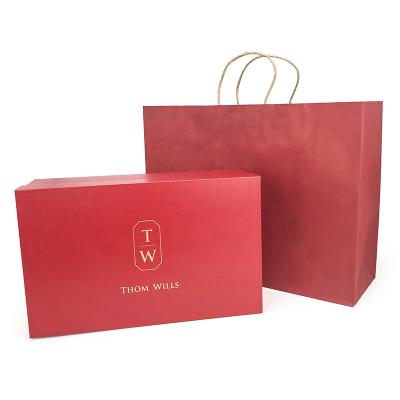 China Luxury Clothing Paper Bag Recyclable Custom Printed Paper Bags Kraft Paper Bag And Clothes Shopping Boxes With Twisted Handle for sale