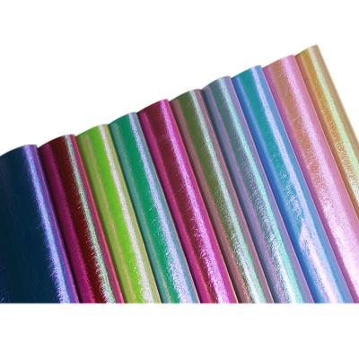 China Anti-rust fabric holographic leather rexine pvc pvc running stock leather for bags shoes belt decoration for sale