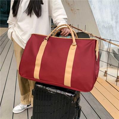 China Captical Large Nylon Gym Bag Custom Woman Travel Bag With Leather Handle Amazon Spend Overnight Duffel Bag for sale