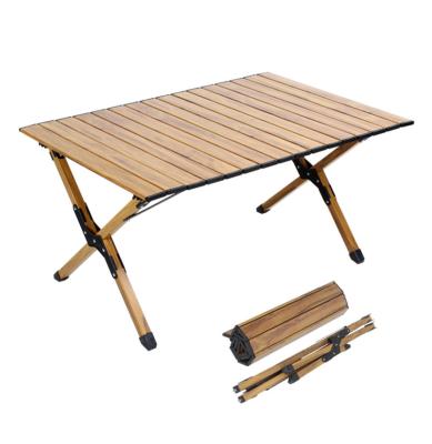 China 2022 New Beech Wood Outdoor Portable Roll Up Light Wood Grain Aluminum Picnic Barbecue Folding Table Camping for sale