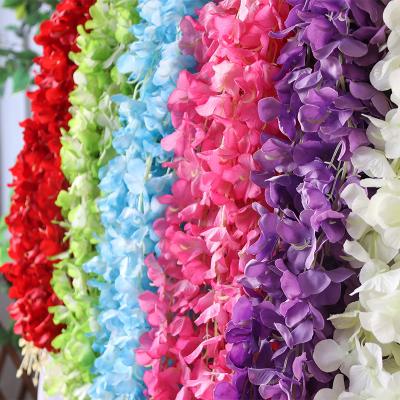 China Beautiful Colorful Wedding Decoration Walk Ceiling Flower Strips Fabric Silk Flower Wisteria Cheap White Artificial Flower for sale